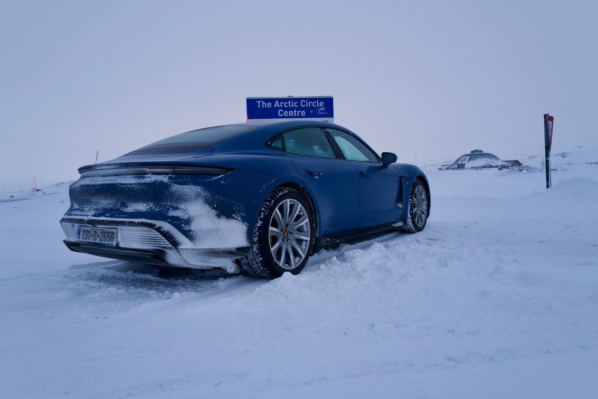 Our Porsche Taycan Turbo S in Neptune Blue at the Arctic Circle