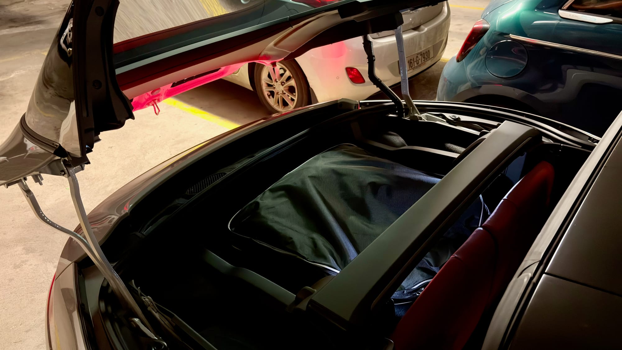 Snow chains bag under folding roof in rear of 911 Targa