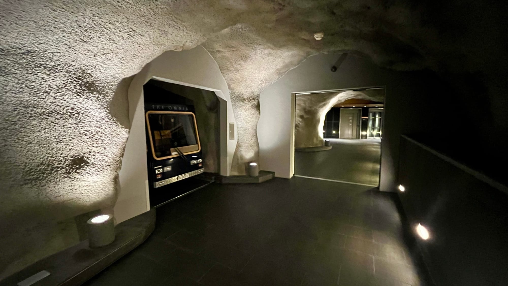 Passing the hotel electric car charging in its cubby in the cave exit out of the hotel