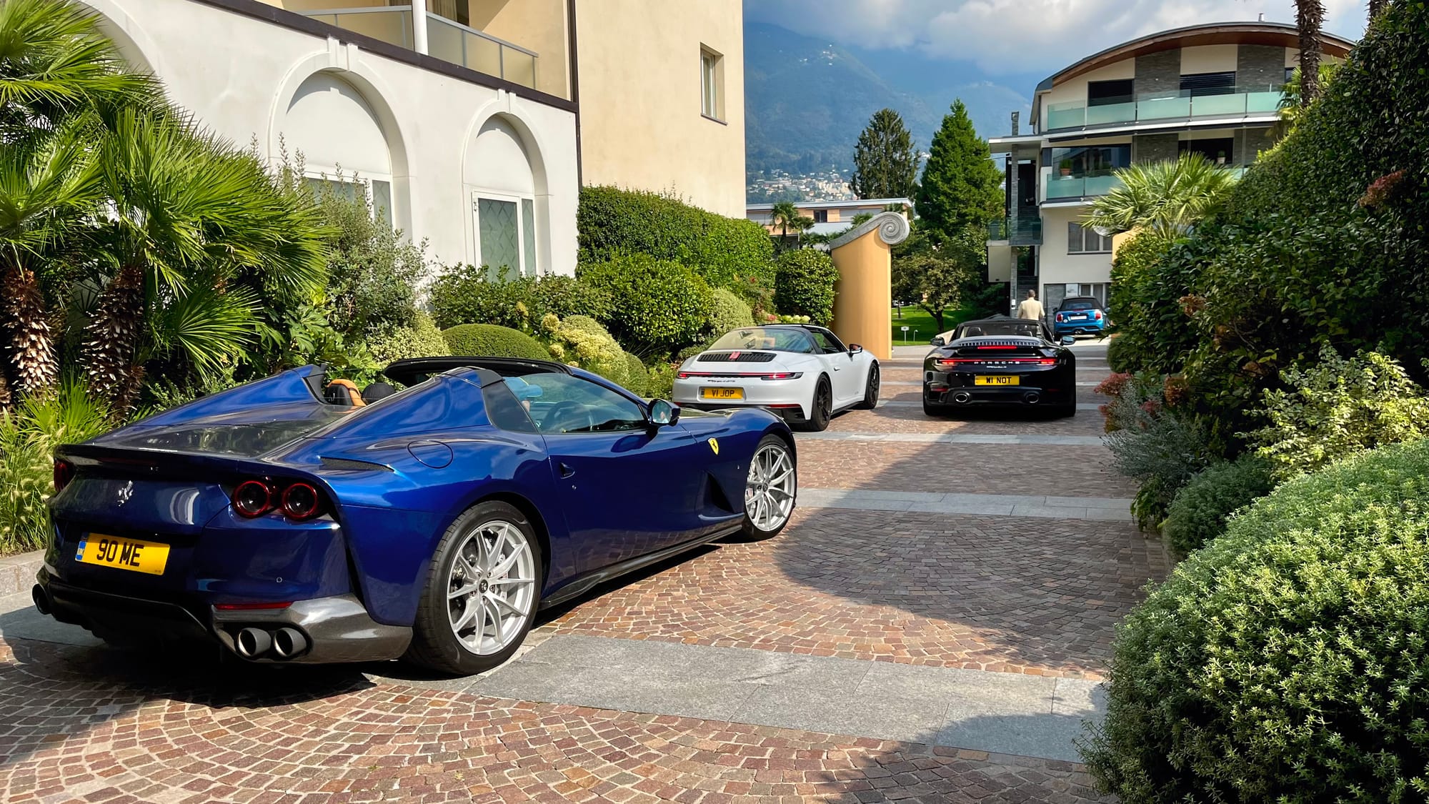 Ferrari and Porsche’s in a group heading out of our hotel for the day
