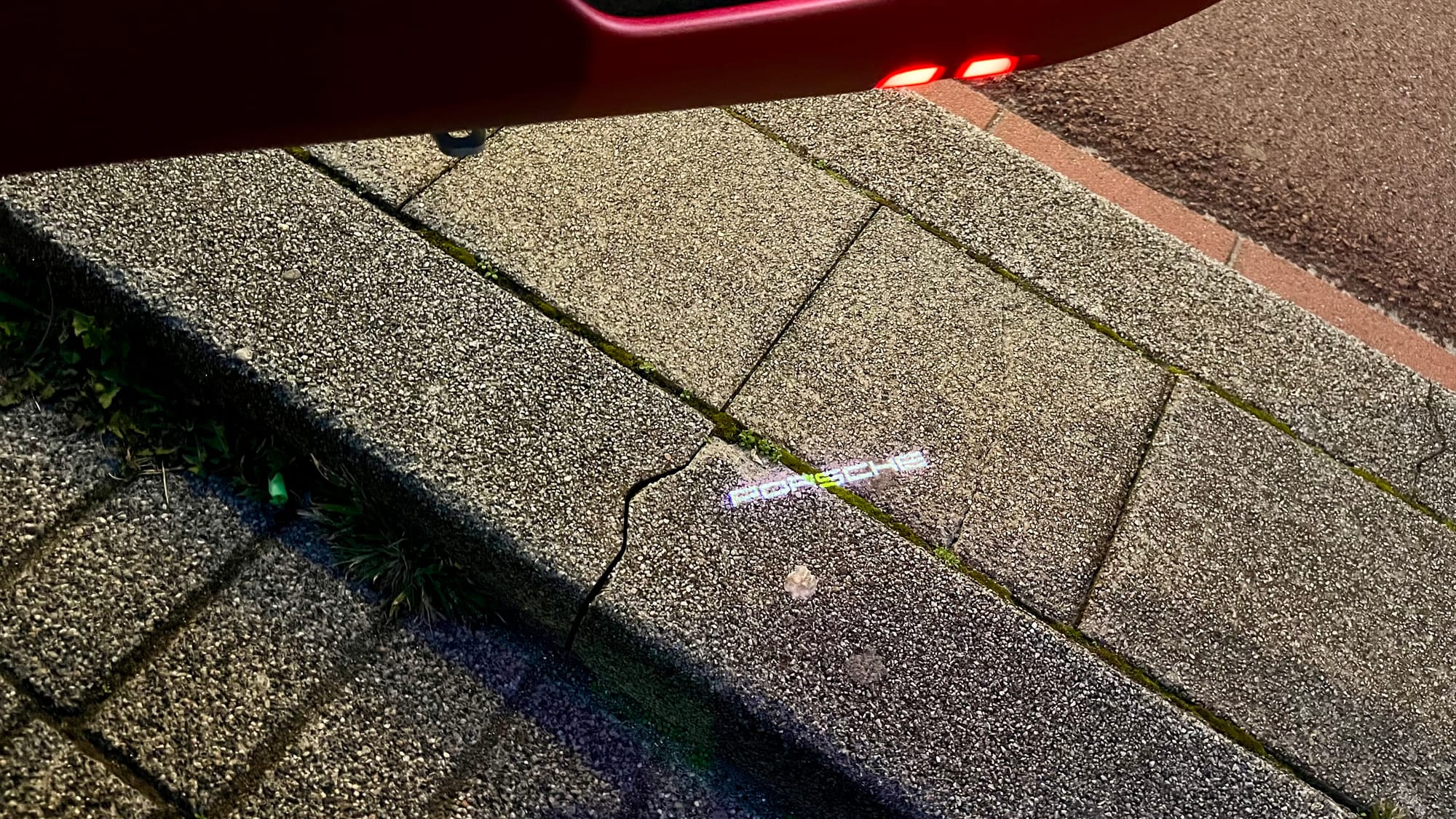 Porsche logo projected onto the ground