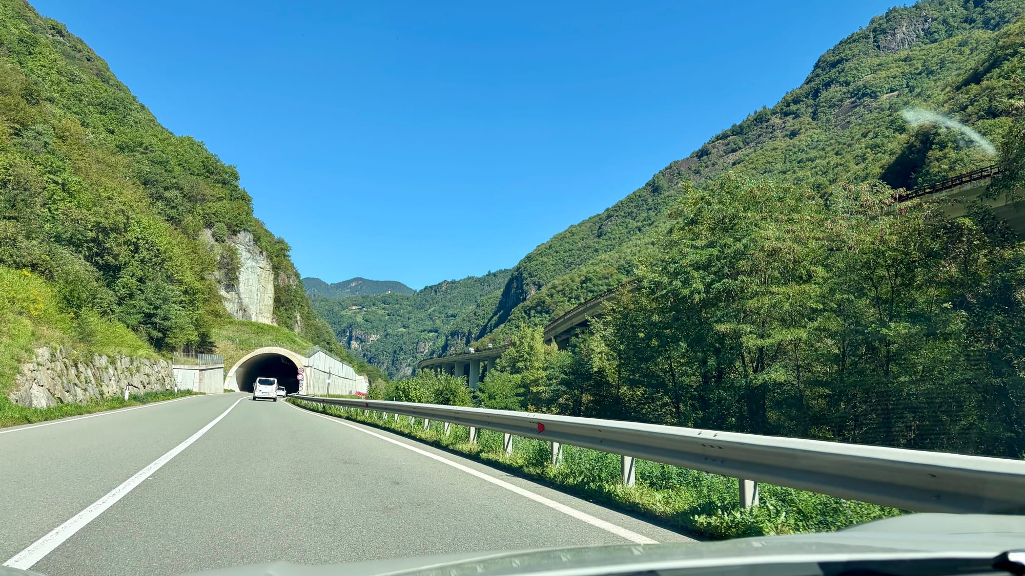Tunnel with the motorway hugging the hills to our right