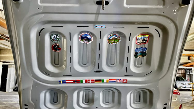 Mountain pass stickers and country flags